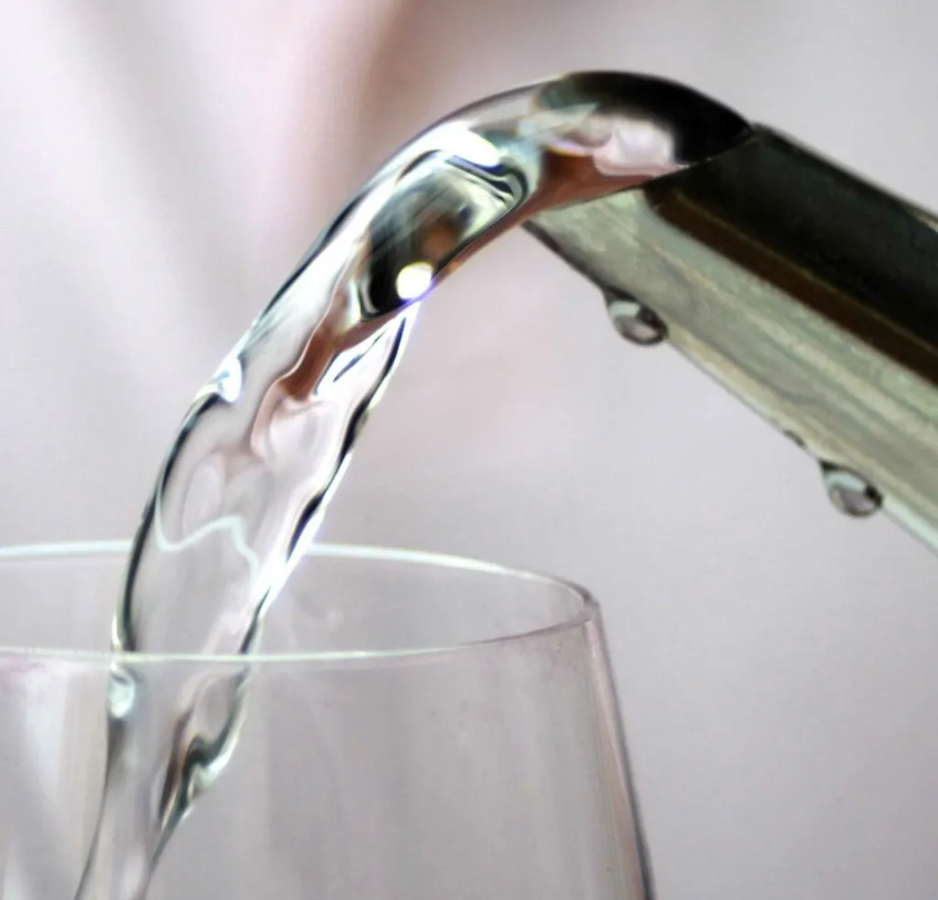 pouring water in a glass