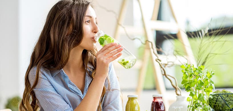 a woman drinking an awesome clean water